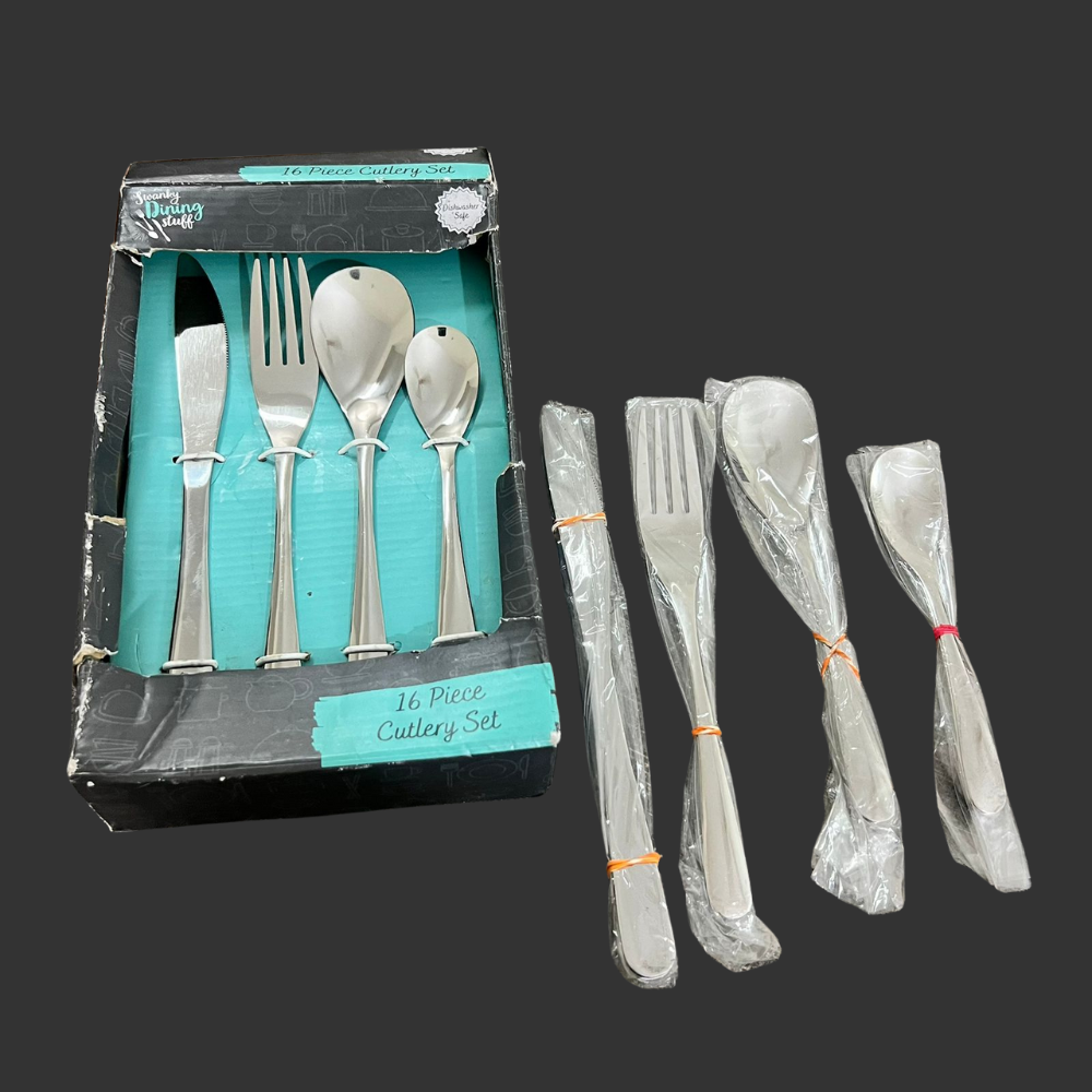 Set of silver cutlery with packaging on a dark background