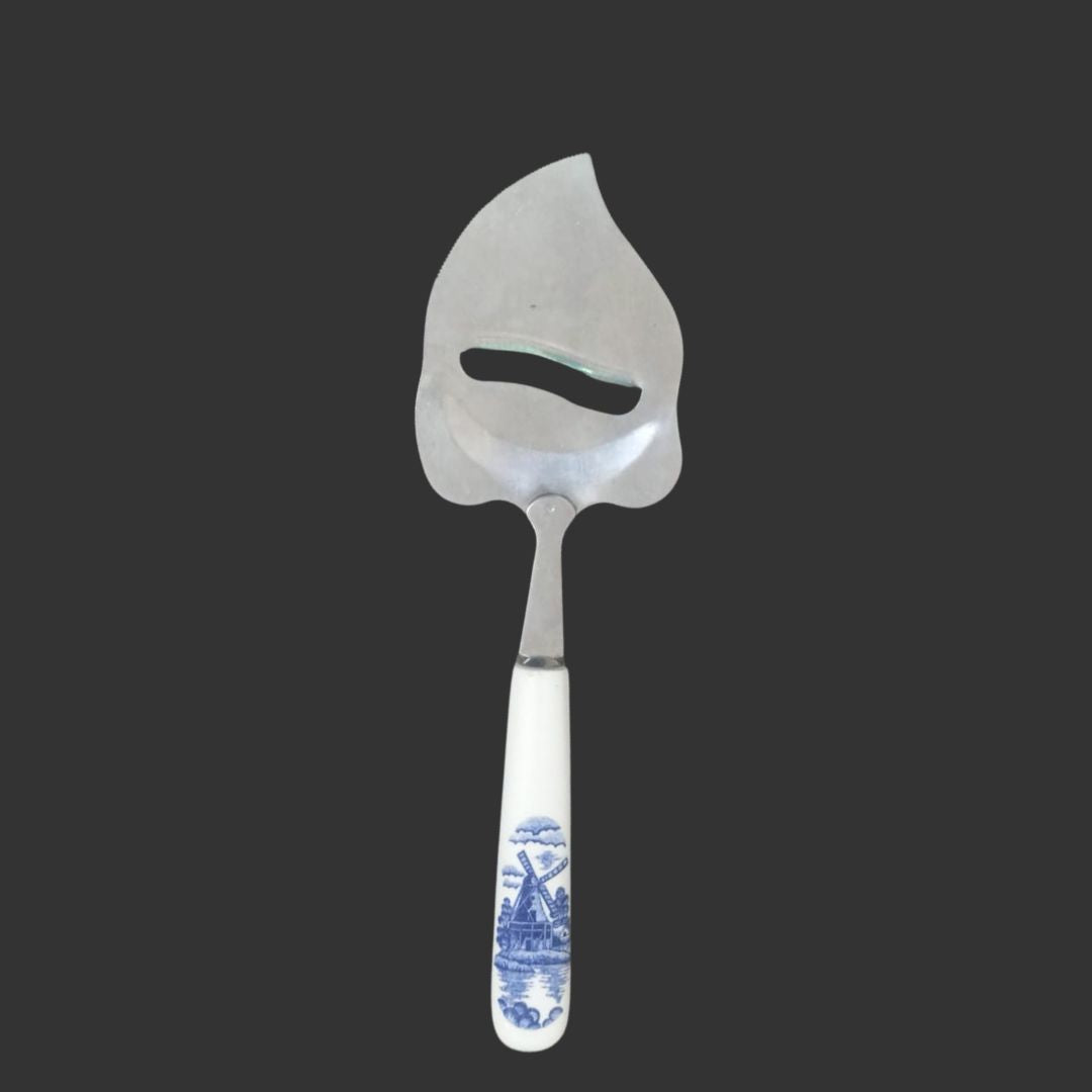 Serving spoon with decorative handle on a black background